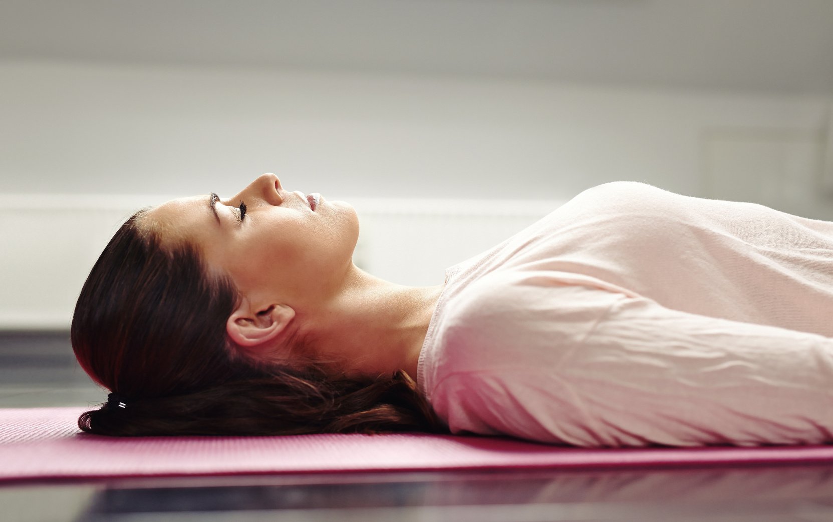 Woman Lying on Mat 