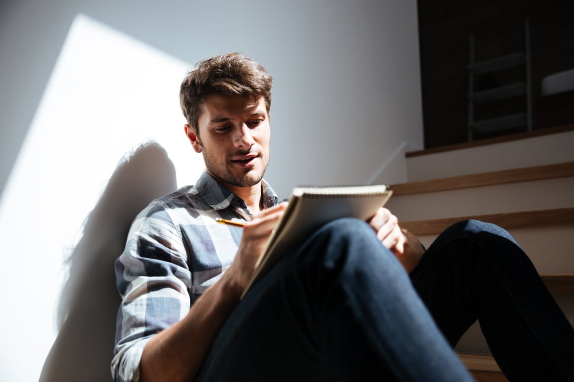 Man Sitting on Stairs  